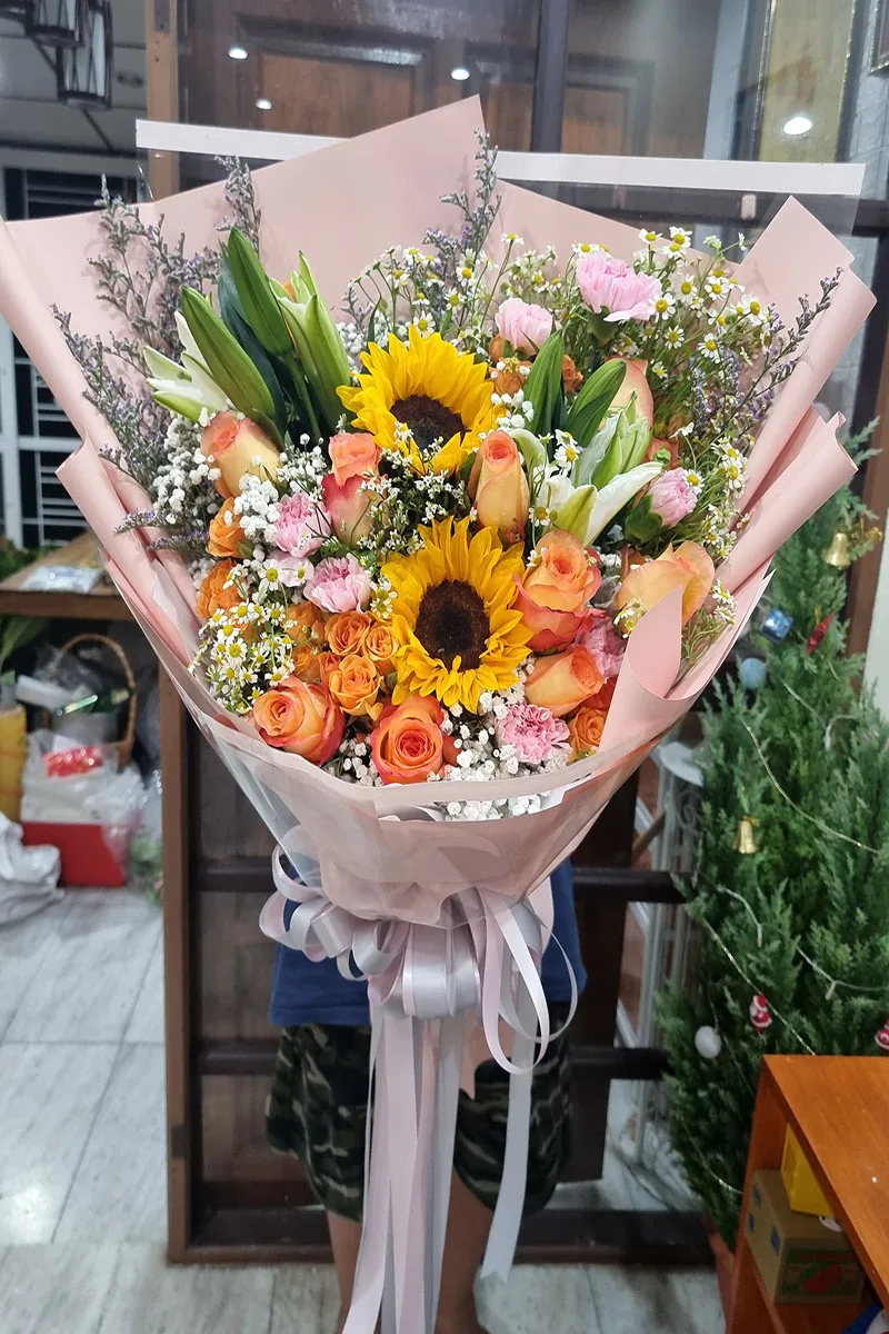 ช่อดอกทานตะวันห่อสีชมพู ช่อรวมดอกทานตะวัน